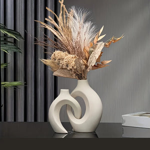 Hollow Nordic Modern Ceramic Vase featuring a sleek minimalist design, ideal for displaying flowers or enhancing home decor with Scandinavian elegance.